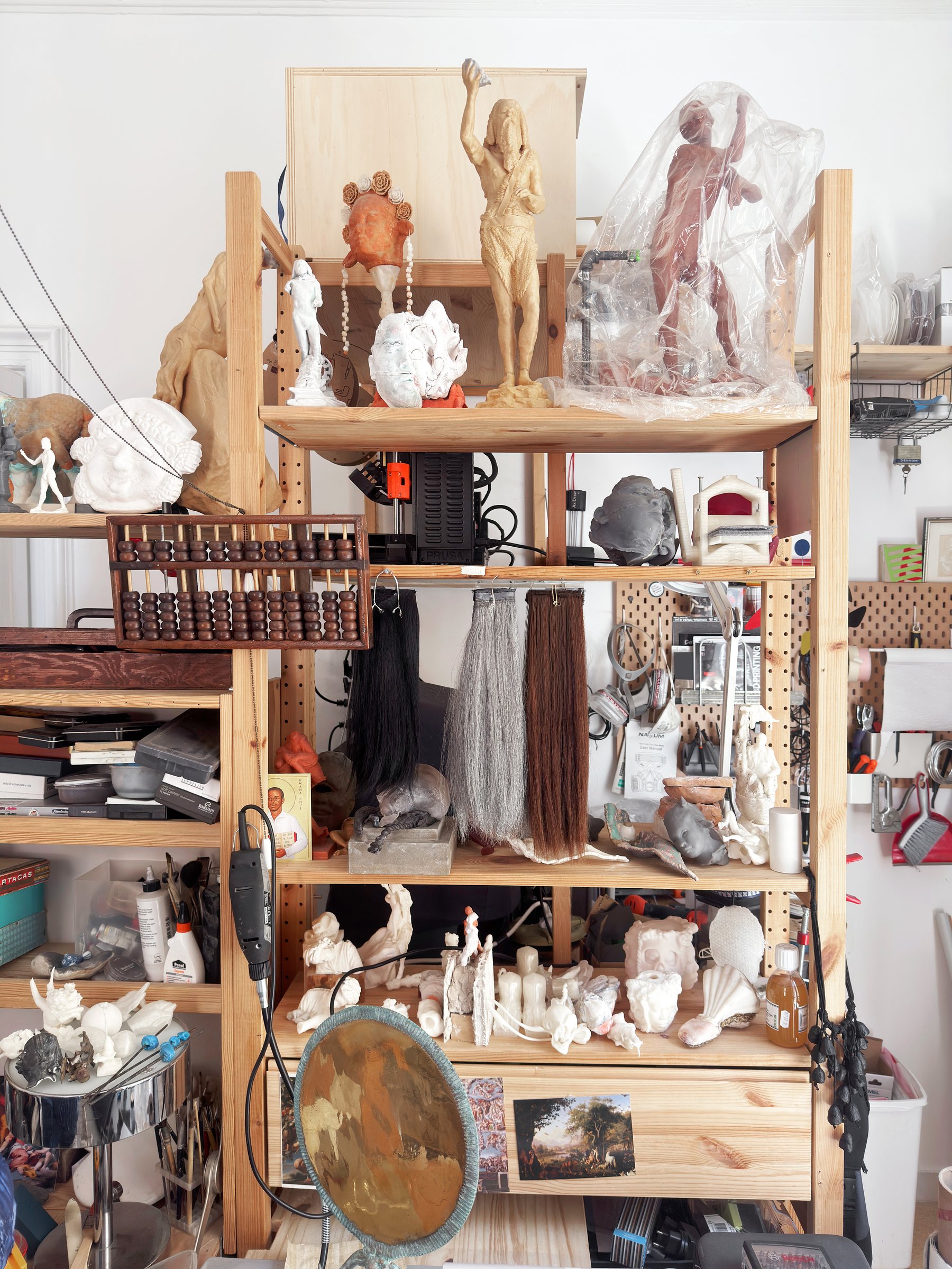 The artist’s studio with works in progress across many materials.